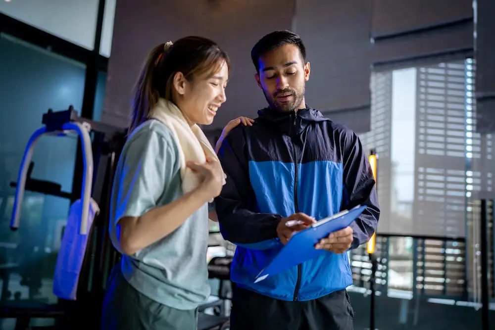 asian man and woman working out one is a trainer 2024 09 27 00 10 00 utc